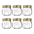 Set of six Kilner jars with gold lids on a white background