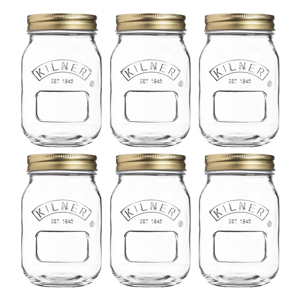 Set of six Kilner jars with gold lids on a white background