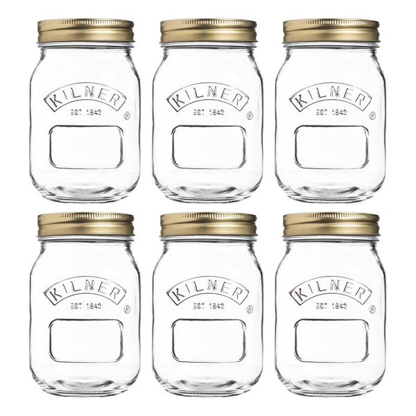 Set of six Kilner jars with gold lids on a white background