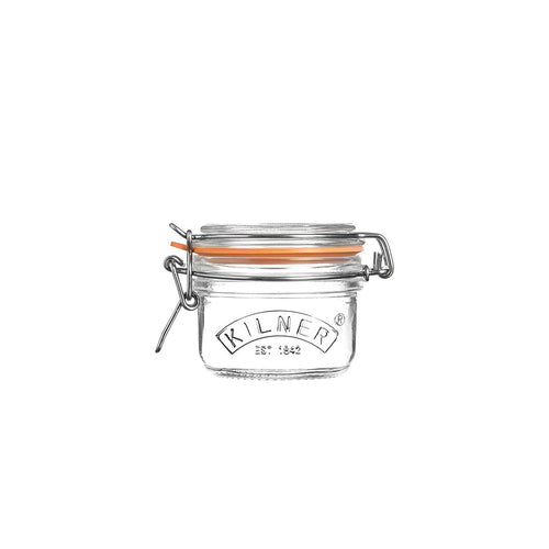 Clear glass Kilner jar with a metal clasp on a white background