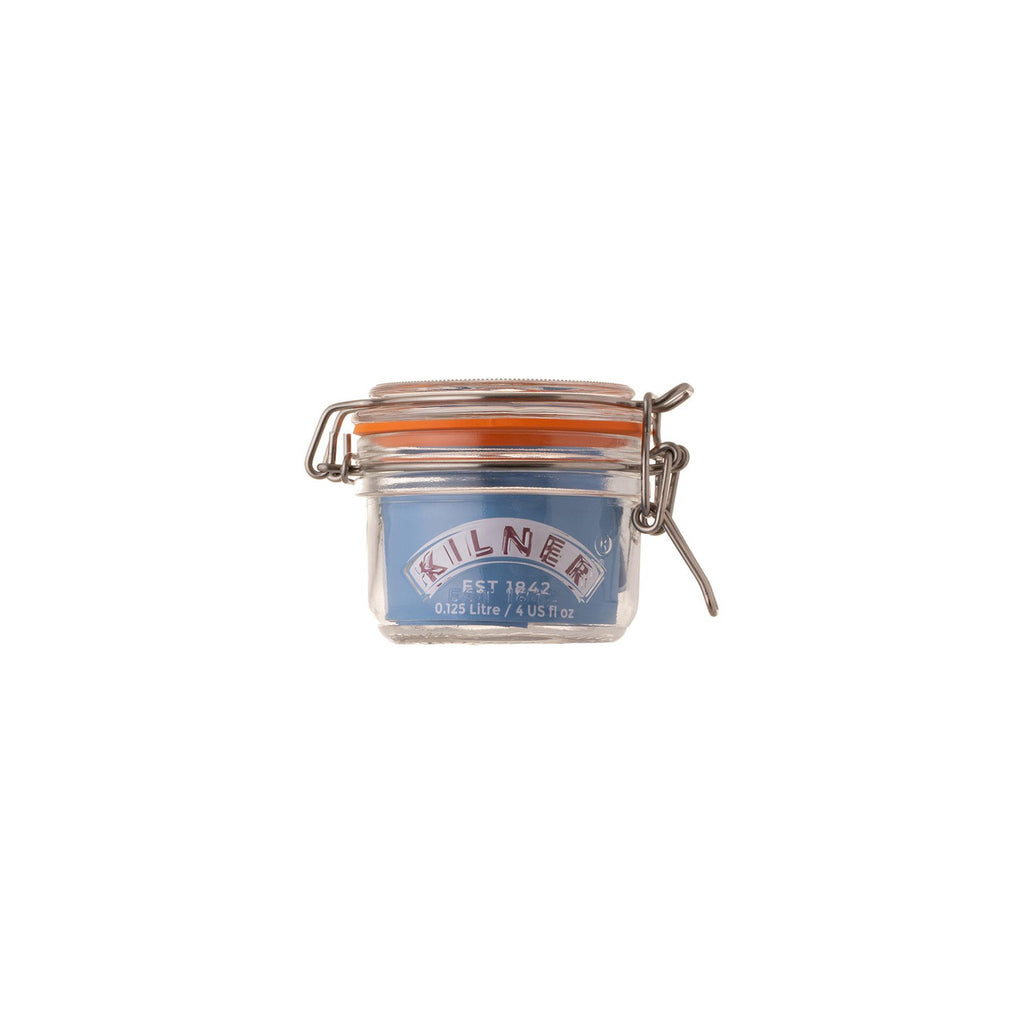 Small glass jar with metal clasp on a white background, featuring the Kilner brand.