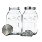 Two clear Kilner jars with metal lids on a white background