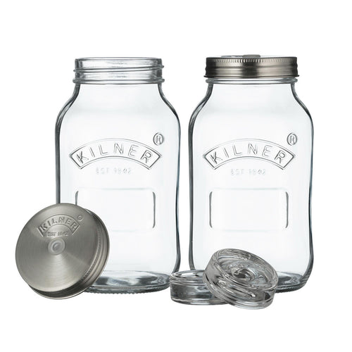 Two clear Kilner jars with metal lids on a white background