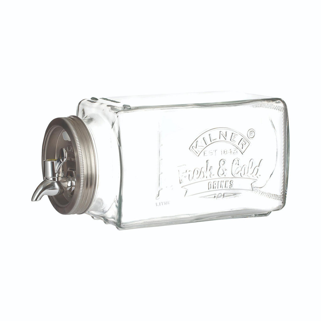 Clear glass beverage dispenser with metal spigot on a white background