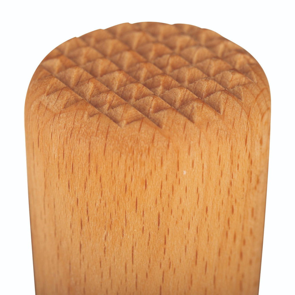 Wooden bottle stopper with textured surface on a white background