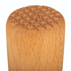 Wooden bottle stopper with textured surface on a white background