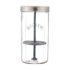 Clear glass jar with a metal lid and gray silicone components on a white background